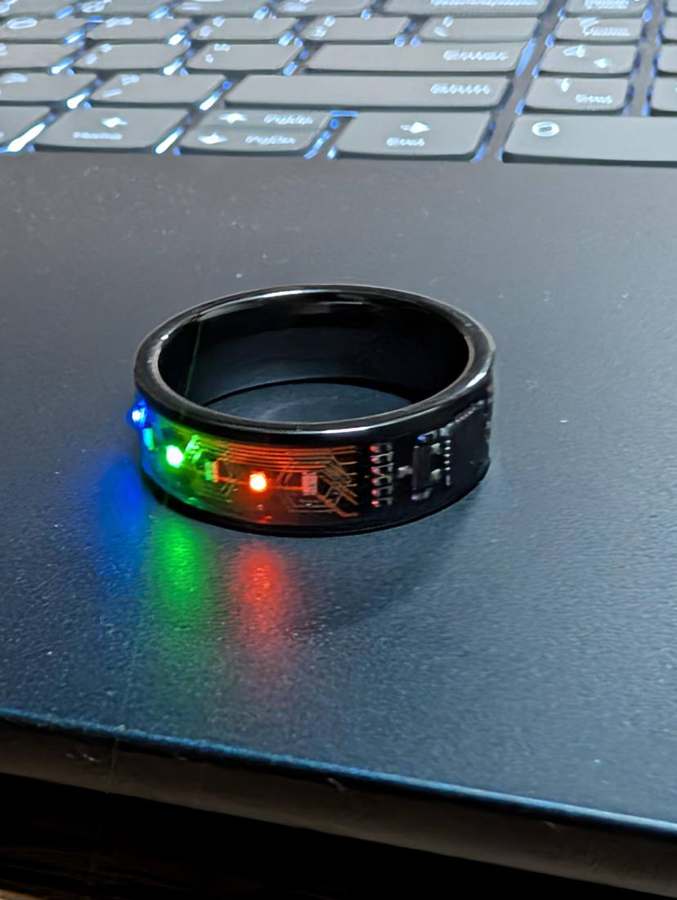 Ring on a laptop with blue, green and red LEDs lit